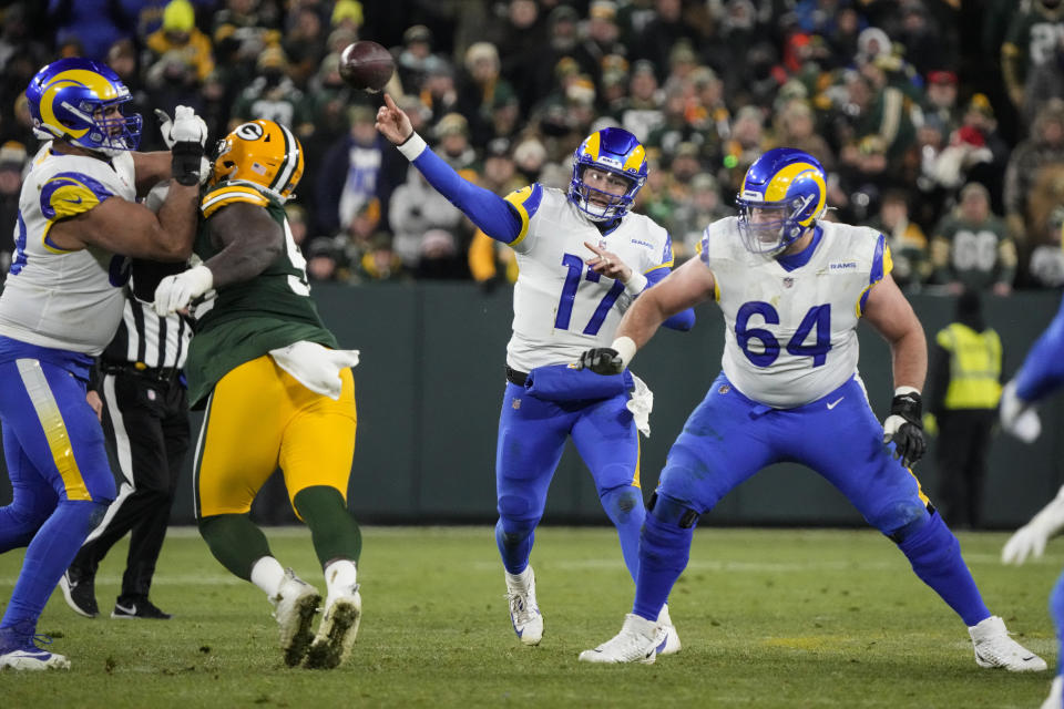 Los angles Rams quarterback Baker Mayfield (17) throws against the Green Bay Packers in the first half of an NFL football game in Green Bay, Wis. Monday, Dec. 19, 2022. (AP Photo/Morry Gash)