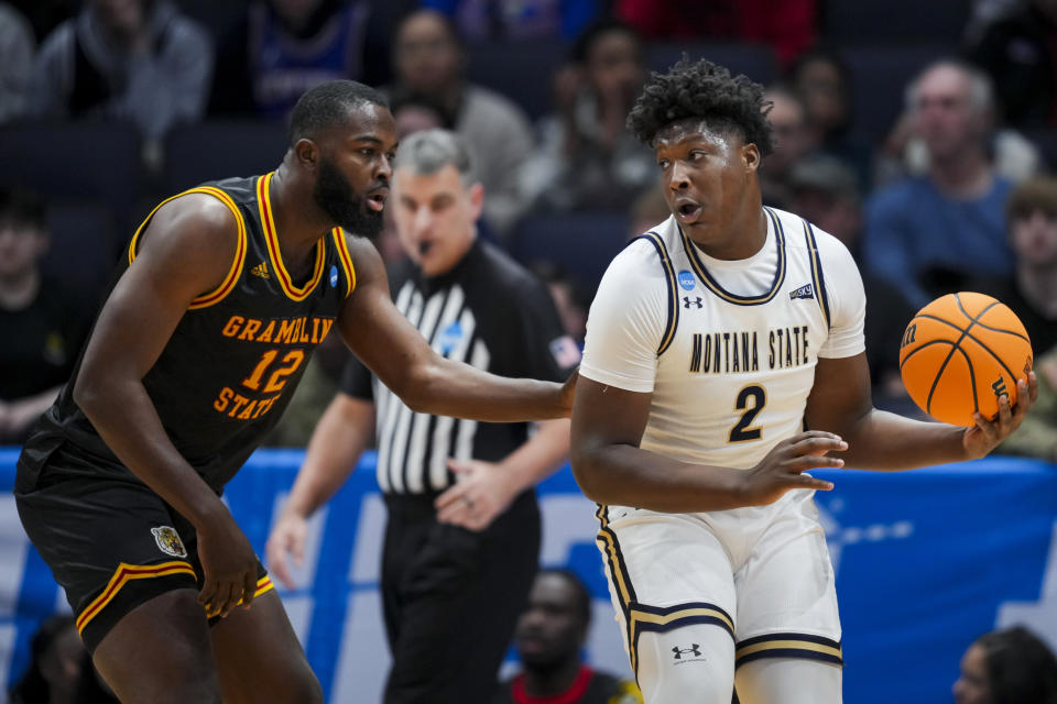 Montana State forward Brandon Walker, right, is defended by Grambling State forward Jonathan Aku during the first half of a First Four game in the NCAA men's college basketball tournament Wednesday, March 20, 2024, in Dayton, Ohio. (AP Photo/Aaron Doster)