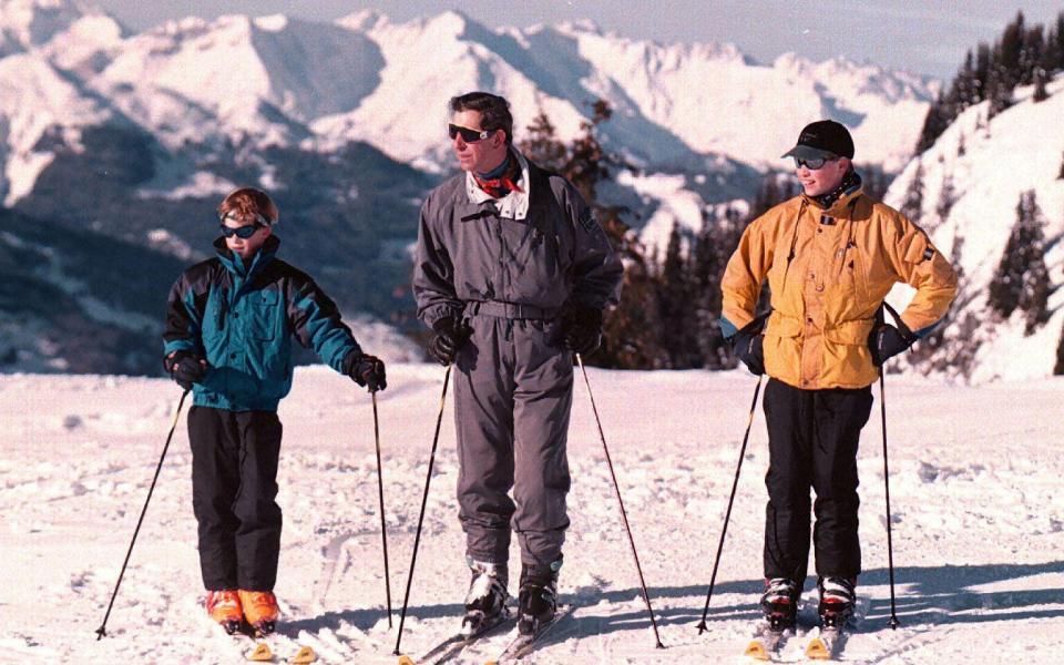 King Charles III, pictured here with Princes William and Harry in 1996, has been a loyal admirer of Klosters.