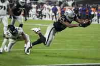 Las Vegas Raiders tight end Darren Waller (83) dives into the end zone for a touchdown against the Baltimore Ravens during the second half of an NFL football game, Monday, Sept. 13, 2021, in Las Vegas. (AP Photo/Rick Scuteri)