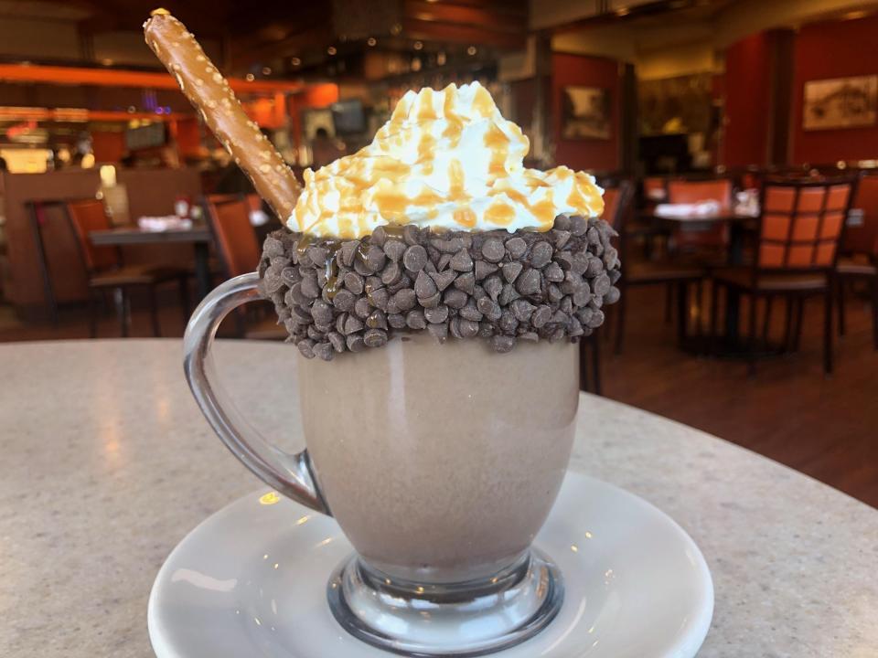 Ghirardelli salted caramel hot chocolate at Orangetown Classic Diner in Orangeburg. This winter warmer is served in a chocolate chip rimmed mug topped with fresh whipped cream, caramel drizzle, and a pretzel stick for that extra sweet and salty crunch. The diner also has a variety of other just as decadent hot chocolate options.