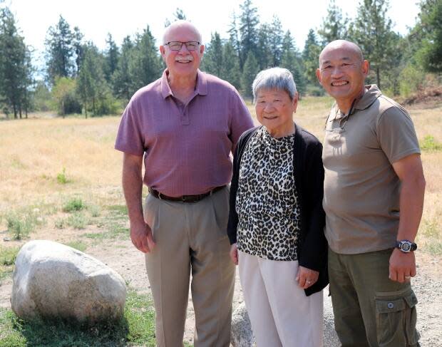 Adrian Marr, right, stands with his mother Ann Marr and West Kelowna Mayor Gord Milsom, left.  (City of West Kelowna - image credit)