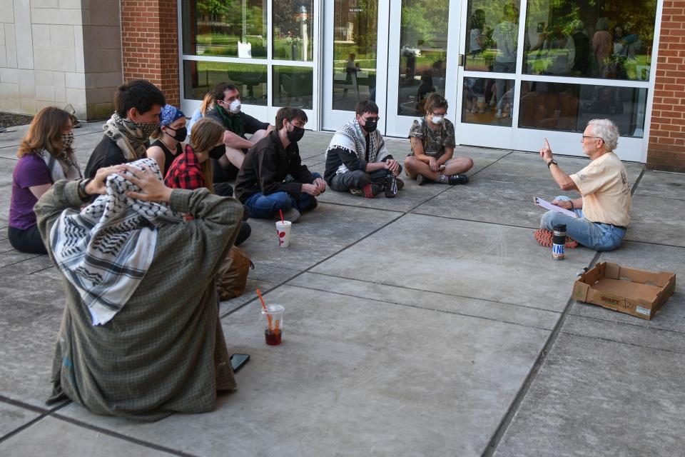 Pro-Palestinian students and activists gather May 11 for a civil disobedience training led by Ralph Hutchison, parent of a University of Tennessee student, in front of the Student Union.