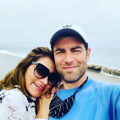 <p>Tess Sanchez Instagram </p> Tess Sanchez and Matthew Greenfield take a selfie at the beach in 2020.