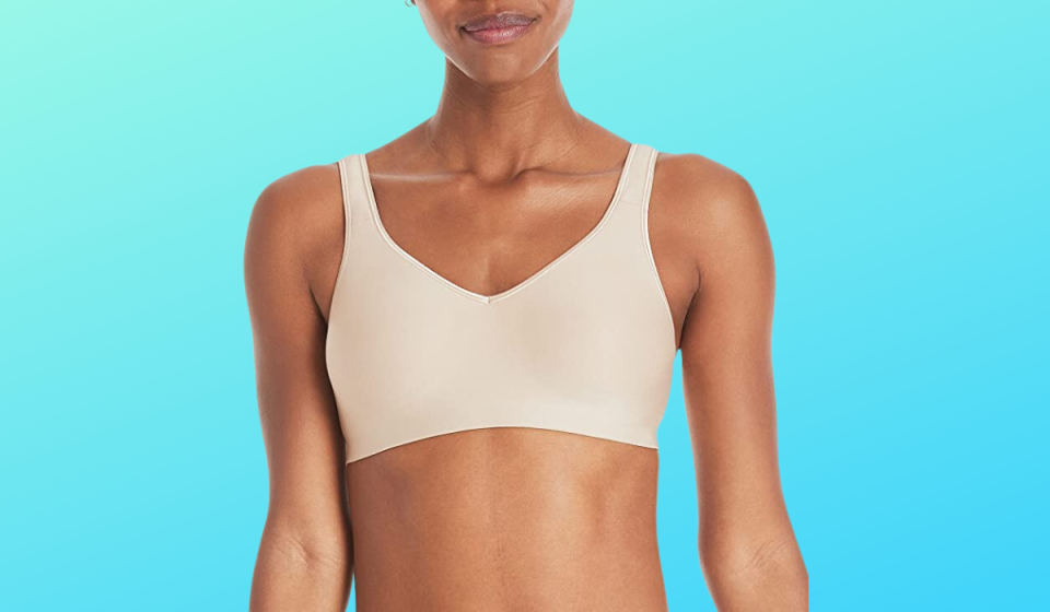 torso of woman wearing beige T-shirt bra
