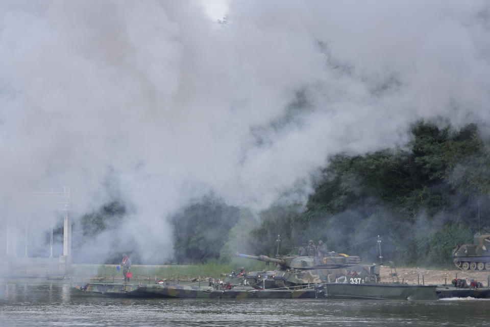 South Korean Army's K1A2 tank on the floating pontoons bridge is carried in smoke during the combined wet gap crossing military drill between South Korea and the United States as a part of the Ulchi Freedom Shield military exercise in Cheorwon, South Korea, on Aug. 31, 2023. (AP Photo/Lee Jin-man)