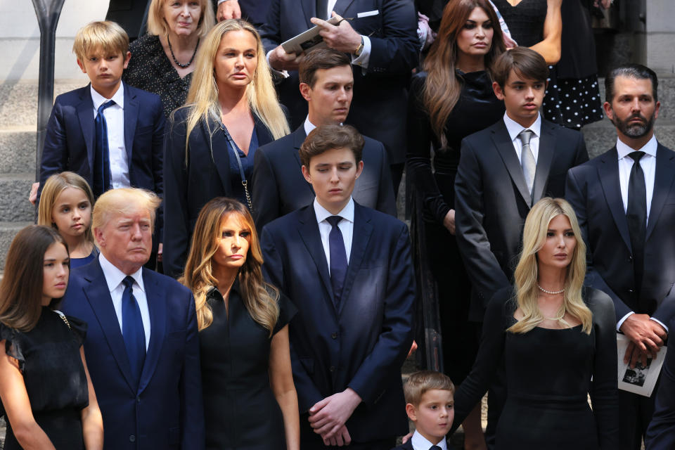NEW YORK, NEW YORK - JULY 20: Former U.S. President Donald Trump and his wife Melania Trump along with their son Barron Trump and Ivanka Trump and their children watch as the casket of Ivana Trump is put in a hearse outside of St. Vincent Ferrer Roman Catholic Church during her funeral on July 20, 2022 in New York City. Trump, the first wife of former U.S. President Donald Trump,  died at the age of 73 after a fall down the stairs of her Manhattan home. (Photo by Michael M. Santiago/Getty Images)