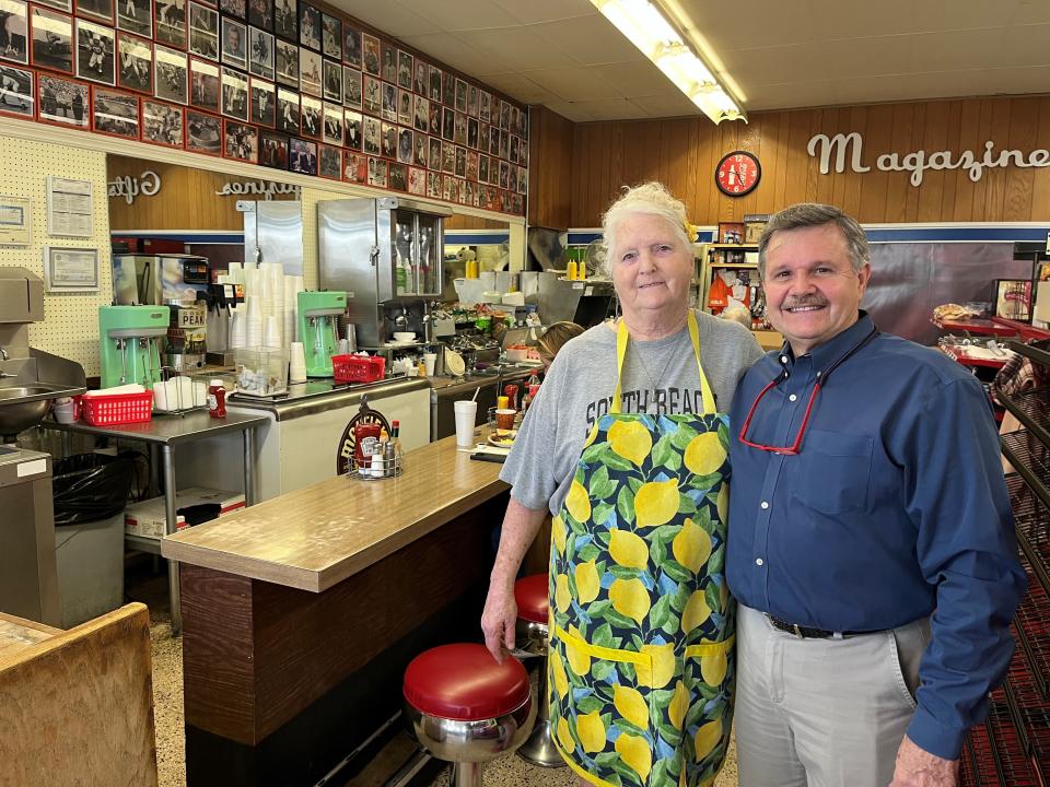 Owner Hank Peck, right, and longtime grill operator Ruth Pate stand inside Long’s Drug Store on Jan. 8, 2024. The store is scheduled to close on Jan. 16.