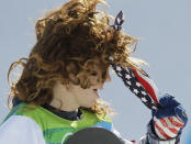 FILE - Shaun White, of the United States, removes his handkerchief as he competes in the men's halfpipe competition at the Vancouver 2010 Olympics in Vancouver, British Columbia, Feb. 17, 2010. The Beijing Olympics will be the fifth Olympics for the three-time gold medalist. And the last Olympics for the 35-year-old — get this — elder-statesman who is now more than double the age of some of the riders he goes against. (AP Photo/Gerry Broome, File)