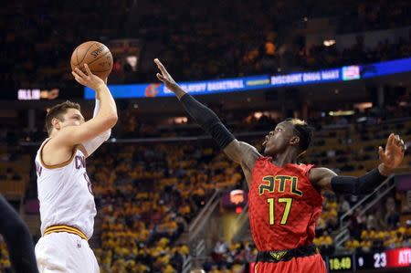 May 4, 2016; Cleveland, OH, USA; Cleveland Cavaliers guard Matthew Dellavedova (8) shoots over Atlanta Hawks guard Dennis Schroder (17) during the second quarter in game two of the second round of the NBA Playoffs at Quicken Loans Arena. Mandatory Credit: Ken Blaze-USA TODAY Sports