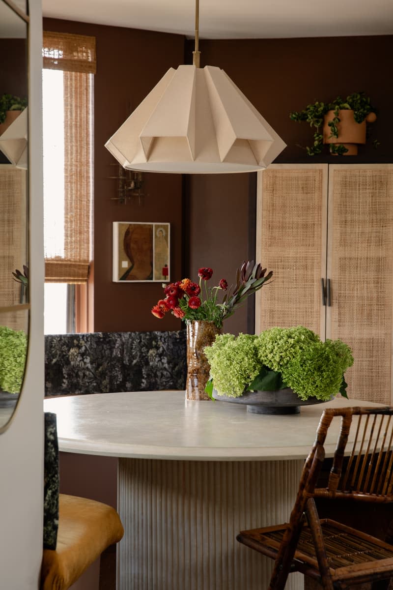 Pendant above dining table in mauve living room.