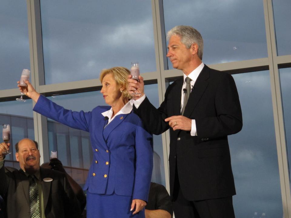 New Jersey Lt. Gov. Kim Guadagno, left, and Revel Entertainment CEO Kevin DeSanctis raise glasses of blueberry smoothies in a toast to employees at the $2.4 billion casino resort Monday, April 2, 2012, in Atlantic City, N.J. The casino resort opened Monday. (AP Photo/Wayne Parry)