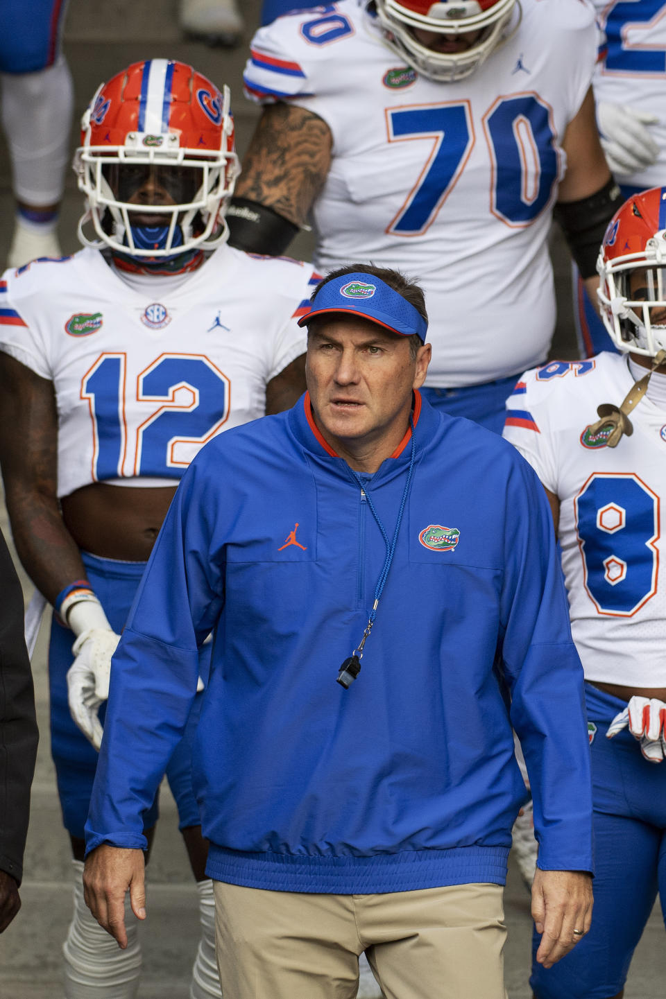 Florida head coach Dan Mullen walks with his team to the field prior to an NCAA college football game against Missouri, Saturday, Nov. 20, 2021, in Columbia, Mo. (AP Photo/L.G. Patterson)