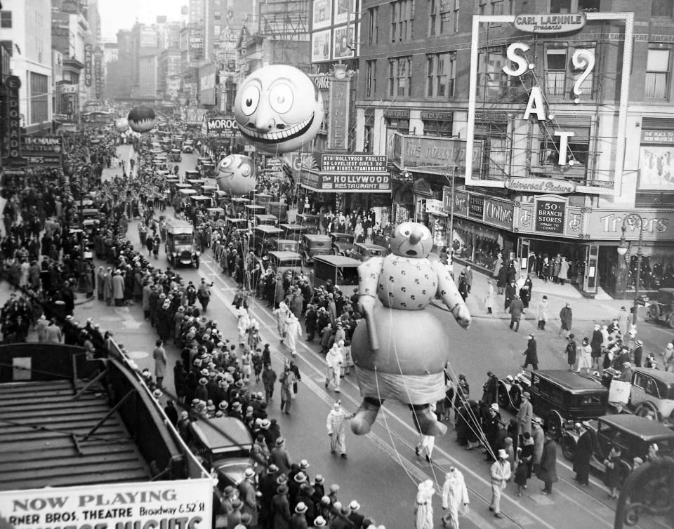 (1930 – The Macy’s Thanksgiving Day Parade passes down Broadway in New York on Nov. 27. AP Photo/File)