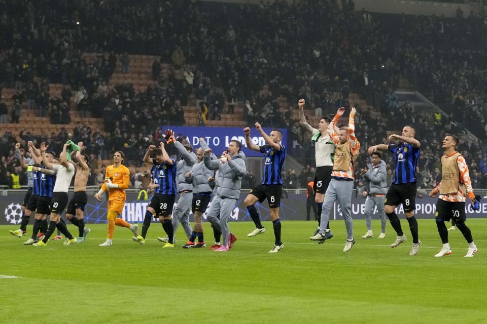 Inter players celebrate after the Champions League, round of 16, first leg soccer match between Inter Milan and Atletico Madrid, at the San Siro stadium in Milan, Italy, Tuesday, Feb. 20, 2024. (AP Photo/Luca Bruno)