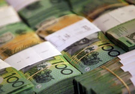 Aussie, kiwi little changed as greenback mildly recovers from Fed minutes