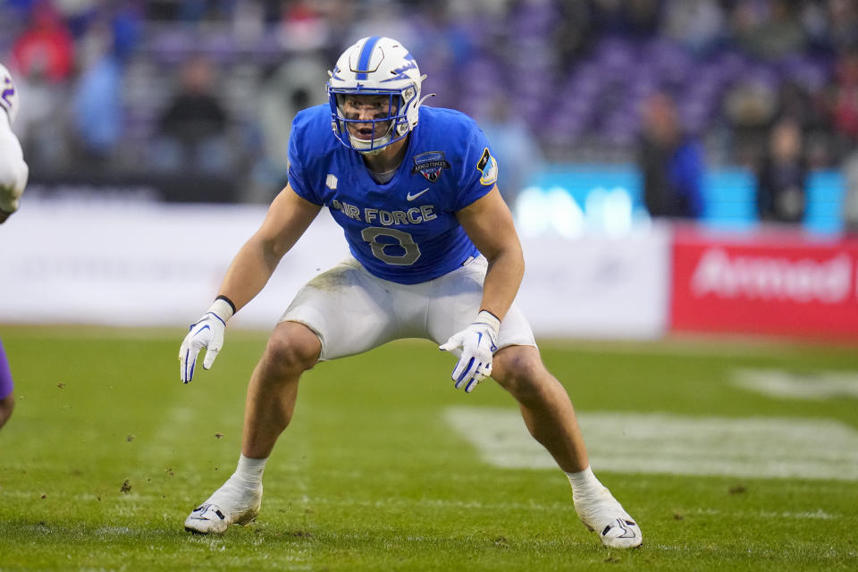 Air Force linebacker Bo Richter, right, eyes James Madison quarterback Jordan McCloud (2) before going in for the tackle during the second half of the Armed Forces Bowl NCAA college football game, Saturday, Dec. 23, 2023, in Fort Worth, Texas. Air Force won 31-21. (AP Photo/Julio Cortez)