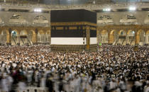 In this photo taken with low shutter speed, Muslim pilgrims circumambulate around the Kaaba, the cubic building at the Grand Mosque, in Mecca, Saudi Arabia, Wednesday, July 6, 2022. Muslim pilgrims are converging on Saudi Arabia's holy city of Mecca for the largest hajj since the coronavirus pandemic severely curtailed access to one of Islam's five pillars. (AP Photo/Amr Nabil)