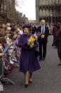 <p>Queen Elizabeth II meets wellwishers outside Ely Cathedral after presenting Maundy money to pensioners. (PA Archive) </p>