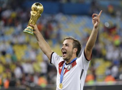 Germany's Mario Goetze celebrates with the World Cup trophy. (AP)