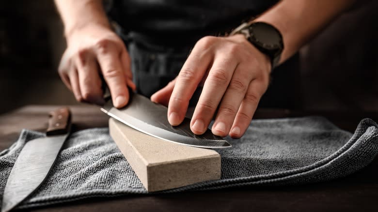 Sharpening a knife on a whetstone