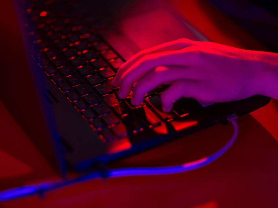 Red light illuminates the keys of a laptop computer. Photographer: Andrey Rudakov/Bloomberg