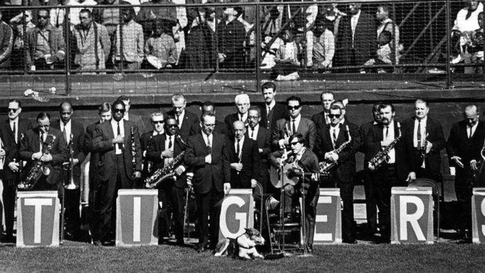 Blind Puerto Rican singer, Jose Feliciano, with his seeing eye dog Trudy, sings the national anthem before the 5th World Series game at Tiger Stadium.