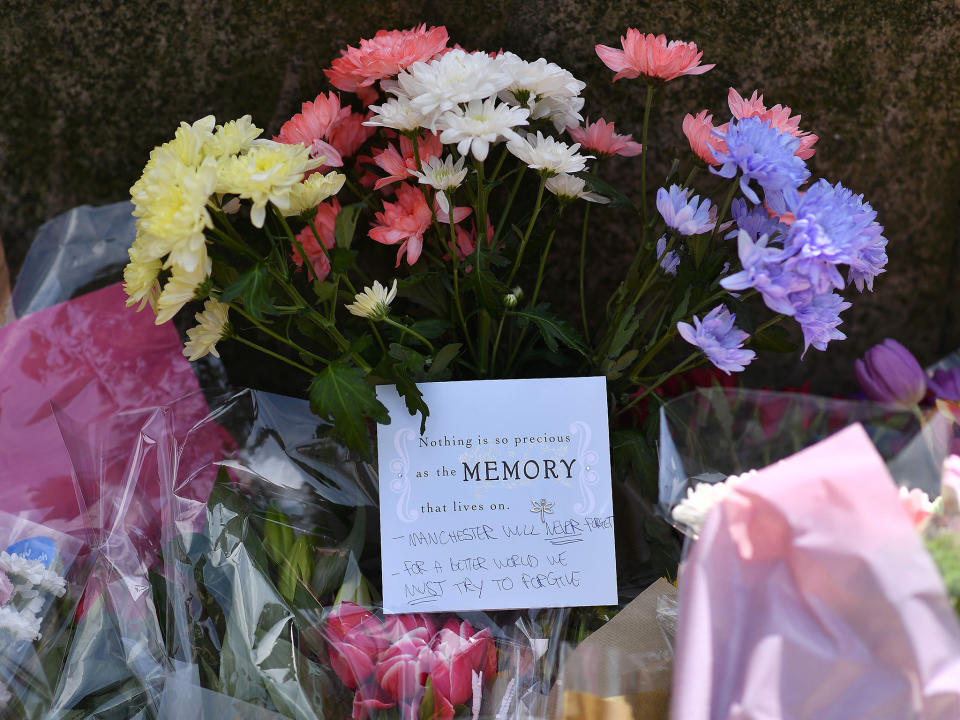 Floral tributes are arriving at the scene in Manchester, where 22 people have been confirmed to have lost their lives: AFP/Getty Images