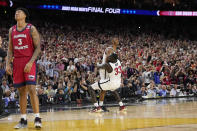 San Diego State guard Lamont Butler celebrates after scoring the game winning basket with forward Aguek Arop (33) during the second half of a Final Four college basketball game against Florida Atlantic in the NCAA Tournament on Saturday, April 1, 2023, in Houston. (AP Photo/David J. Phillip)
