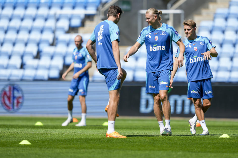 Erling Haaland, foreground center, trains with teammates of the national football team at the Ullevaal stadium before the European Championship qualifiers against Scotland and Cyprus, in Oslo, Norway, Wednesday June 14, 2023. (Fredrik Varfjell/NTB Scanpix via AP)