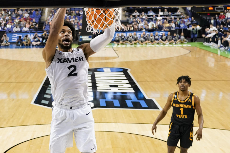 Xavier forward Jerome Hunter dunks against Kennesaw State during the first half of a first-round college basketball game in the NCAA Tournament on Friday, March 17, 2023, in Greensboro, N.C. (AP Photo/Chris Carlson)