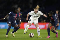 Hacken's Johanna Fossdalsa Sorensen, center, vies for the ball with PSG's Tabitha Chawinga, left, and Grace Geyoro during the women's Champions League quarterfinals, second leg, soccer match between Paris Saint-Germain and BK Hacken at Parc des Princes, in Paris, Thursday, March 28, 2024. (AP Photo/Thibault Camus)