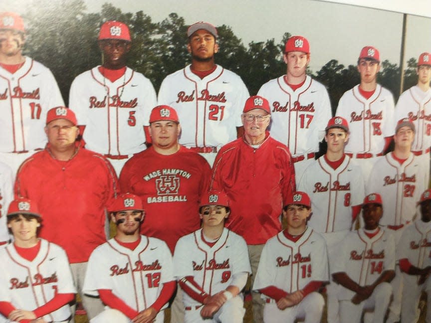 Randolph Murdaugh III, in red third from left, coached his grandson, Buster, in varsity baseball. Buster Murdaugh is pictured in the No. 17 jersey behind his grandfather.