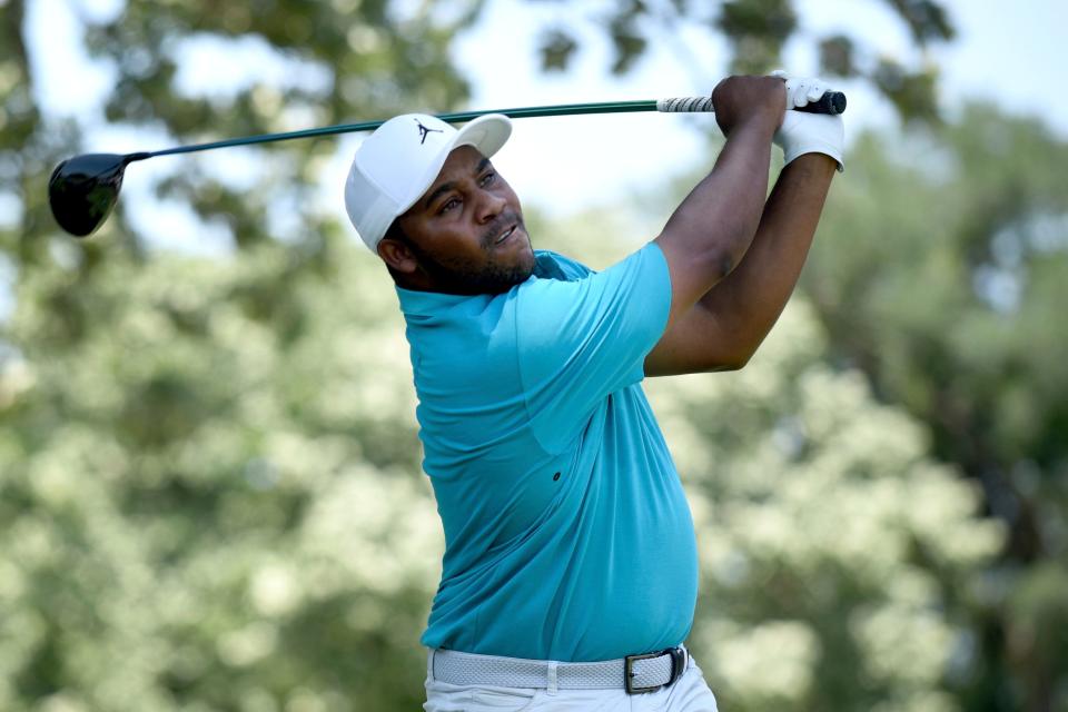 Harold Varner III watches his tee shot on the third hole during the third round of the Charles Schwab Challenge golf tournament at the Colonial Country Club, Saturday, May 28, 2022, in Fort Worth, Texas. (AP Photo/Emil Lippe)