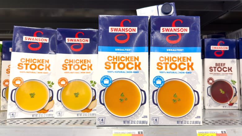 Containers of chicken stock at store