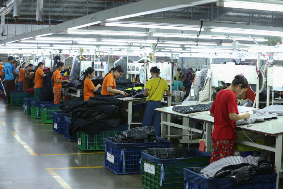 Employees work at a garment factory in Yangon, Myanmar, May 12, 2023. Myanmar earned $384 million from the exports of garments manufactured under the cut-make-pack CMP system in April this year, the state media citing the Myanmar Garment Manufacturers Association reported.