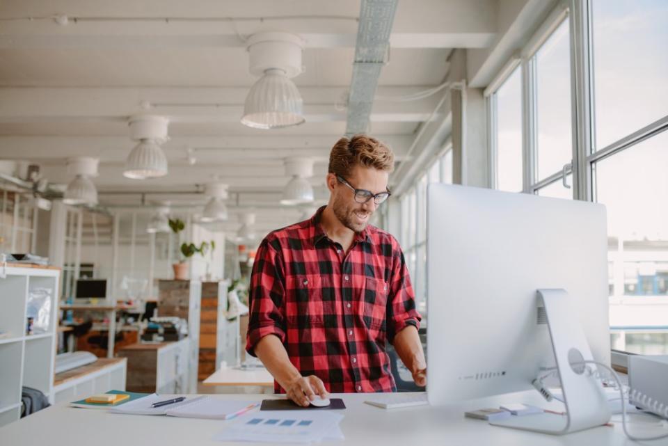 If you have a desk job, science suggests standing might save your life. Jacob Lund – stock.adobe.com