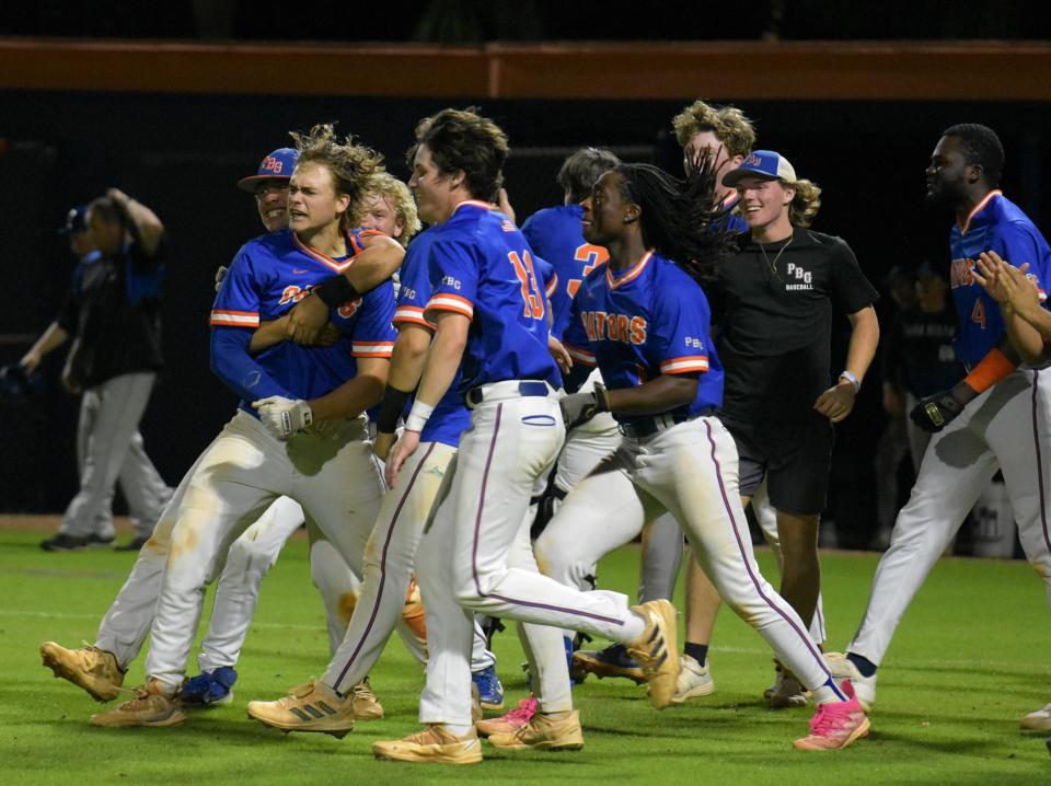 Palm Beach Gardens' Luke Hogue shows emotion after crossing home plate following his walk-off home-run in the bottom of the eighth inning against Park Vista on Mar. 12, 2024.