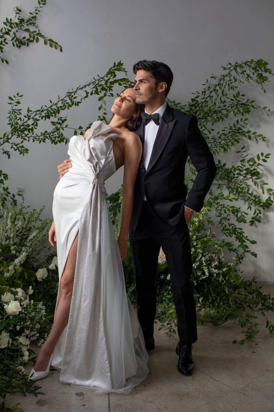 In custom Galia Lahav and Stuart Weitzman; Ian in Brioni Couture Tuxedo and Prada shoes.