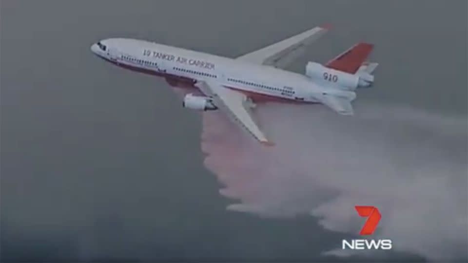 Heavy duty aerial waterbombing aircrafts fought the thick smoke billows across the town. Photo: 7 News