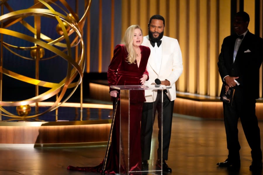 Christina Applegate, left, presents the award for outstanding supporting actress in a comedy series during the 75th Primetime Emmy Awards on Monday, Jan. 15, 2024, at the Peacock Theater in Los Angeles. (AP Photo/Chris Pizzello)