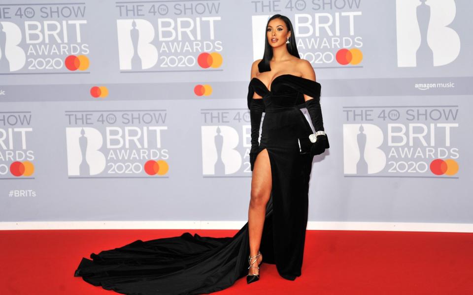 Maya Jama who donned a black velvet AloNuko gown with a thigh-split and Diana-esque sweetheart neckline to the Brit awards in 2020