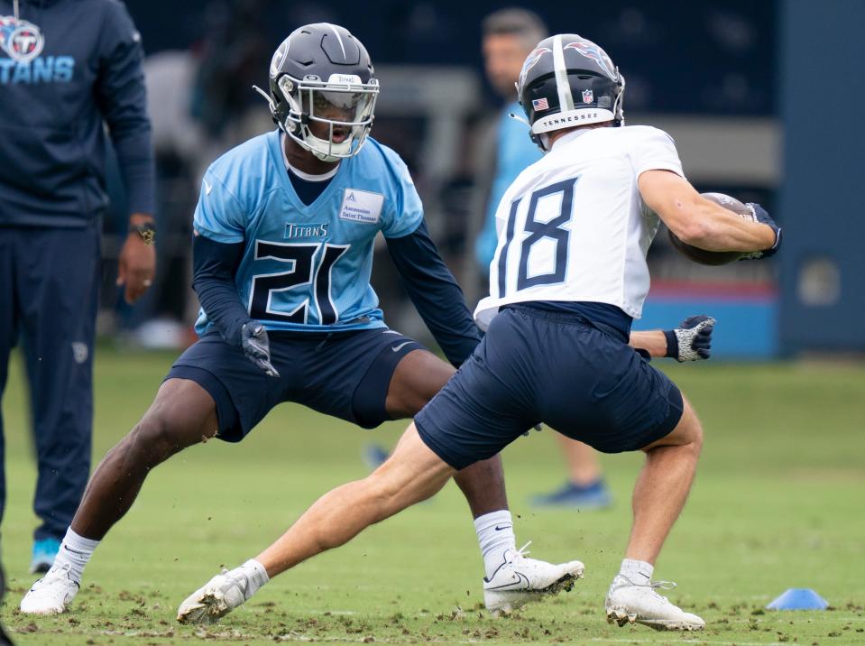 Tennessee Titans cornerback Roger McCreary tracks down wide receiver Kyle Phillips (18) during practice at Saint Thomas Sports Park Tuesday, May 24, 2022, in Nashville, Tenn. 