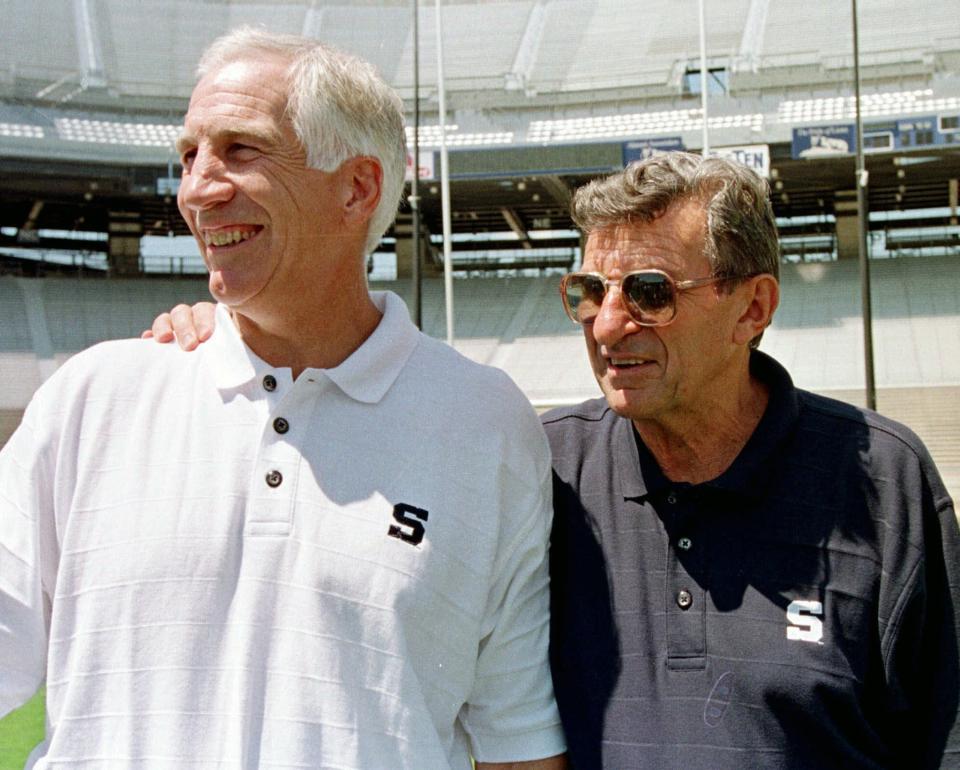 FILE - In this Aug. 6, 1999, file photo, Penn State head football coach Joe Paterno, right, poses with his defensive coordinator Jerry Sandusky during Penn State Media Day at State College, Pa. Joe Paterno's son said Friday, May 6, 2016, that an allegation made by insurers that a boy told the longtime Penn State University football coach in 1976 that he had been molested by former assistant coach Jerry Sandusky is 