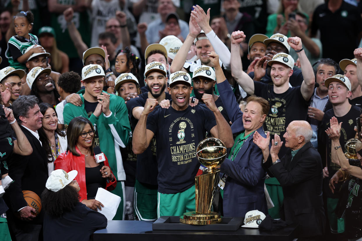 BOSTON, MASSACHUSETTS - JUNE 17: Jayson Tatum #0, Al Horford #42, Jaylen Brown #7 of the Boston Celtics celebrate after Boston's 106-88 win against the Dallas Mavericks in Game Five of the 2024 NBA Finals at TD Garden on June 17, 2024 in Boston, Massachusetts. NOTE TO USER: User expressly acknowledges and agrees that, by downloading and or using this photograph, User is consenting to the terms and conditions of the Getty Images License Agreement. (Photo by Adam Glanzman/Getty Images)