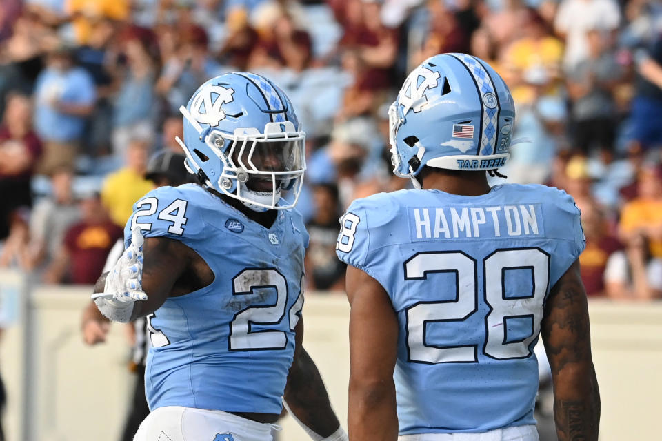 Sep 16, 2023; Chapel Hill, North Carolina, USA; North Carolina Tar Heels running back British Brooks (24) reacts with running back Omarion Hampton (28) after scoring a touchdown in the fourth quarter at Kenan Memorial Stadium. Mandatory Credit: Bob Donnan-USA TODAY Sports