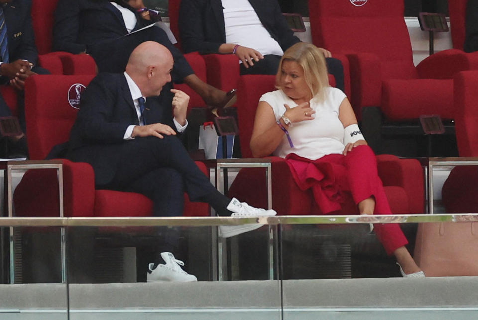 Soccer Football - FIFA World Cup Qatar 2022 - Group E - Germany v Japan - Khalifa International Stadium, Doha, Qatar - November 23, 2022 German Interior Minister Nancy Faeser is seen wearing the OneLove armband alongside FIFA president Gianni Infantino REUTERS/Lee Smith