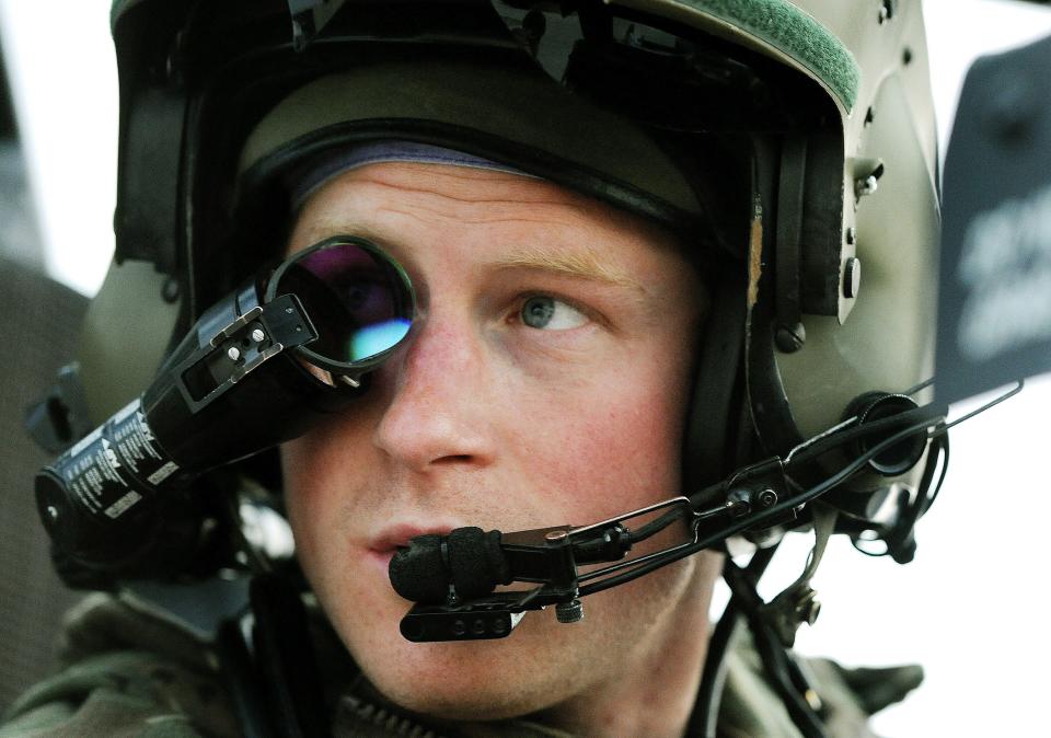 Britain’s Prince Harry or just plain Captain Wales as he is known in the British Army, wears his monocle gun sight as he sits in the front seat of his cockpit at the British controlled flight-line in Camp Bastion southern Afghanistan.