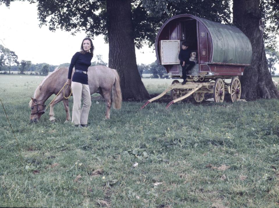 <p>Lee Radziwill poses with her horse during a photoshoot at her English estate, Turville Grange, in Buckinghamshire. The American society, who was married to Prince Stanislaw of Poland until 1974, is joined by her son, Anthony, and their pet Labrador for the photo. </p>