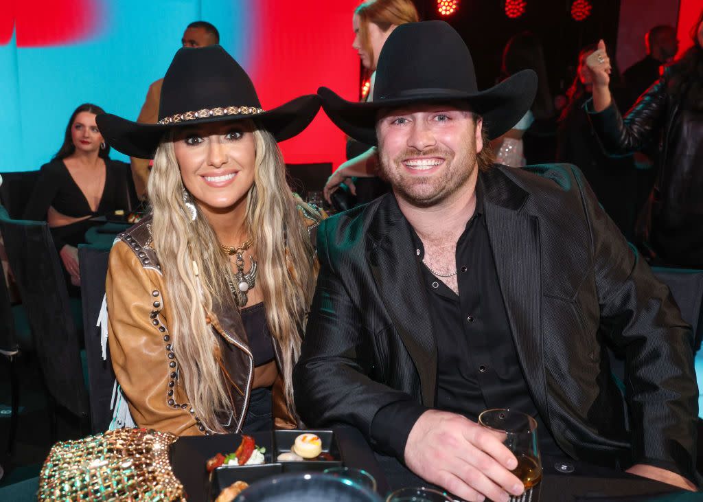 santa monica, california february 18 2024 peoples choice awards pictured l r lainey wilson and devlin duck hodges attend the 2024 peoples choice awards held at barker hangar on february 18, 2024 in santa monica, california photo by rich polknbc via getty images